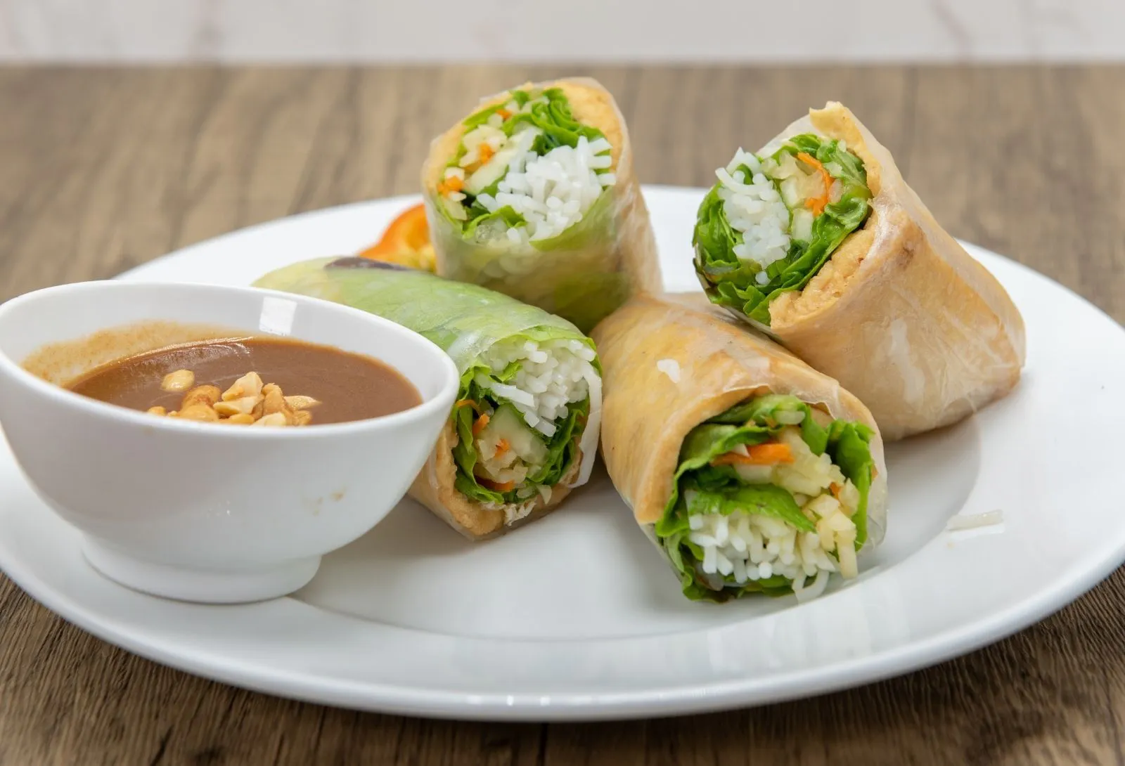 Fresh Vietnamese spring rolls with creamy peanut dipping sauce at Pho Saigon, a Vietnamese Restaurant in Grand Island